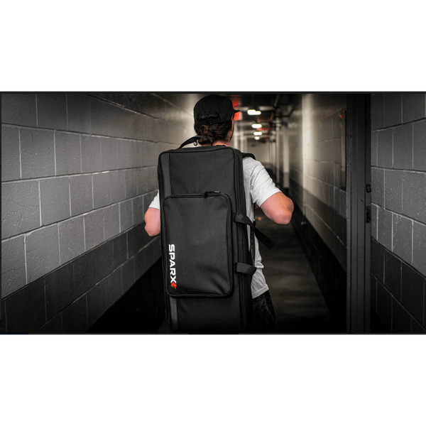 Man carrying sparx travel case on his back